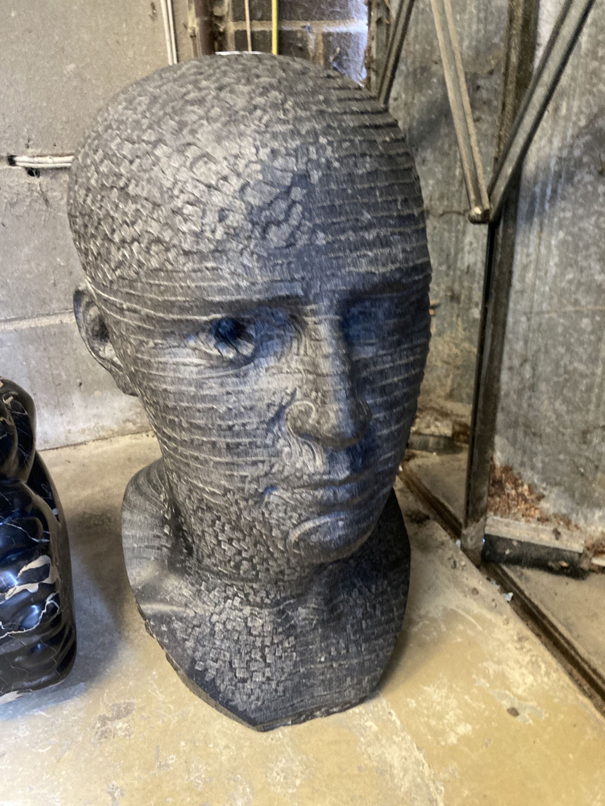 § Andrew Tanser, Communicate, a carved Kilkenny limestone head, width 24cm, depth 30cm, height 56cm